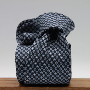 Cruciani &amp; Bella
100% Printed Silk

Self-Tipped
Dark Blue and Grey Motif Tie&nbsp;
Handmade in Rome, Italy.

8 cm x 150 cm
#9290