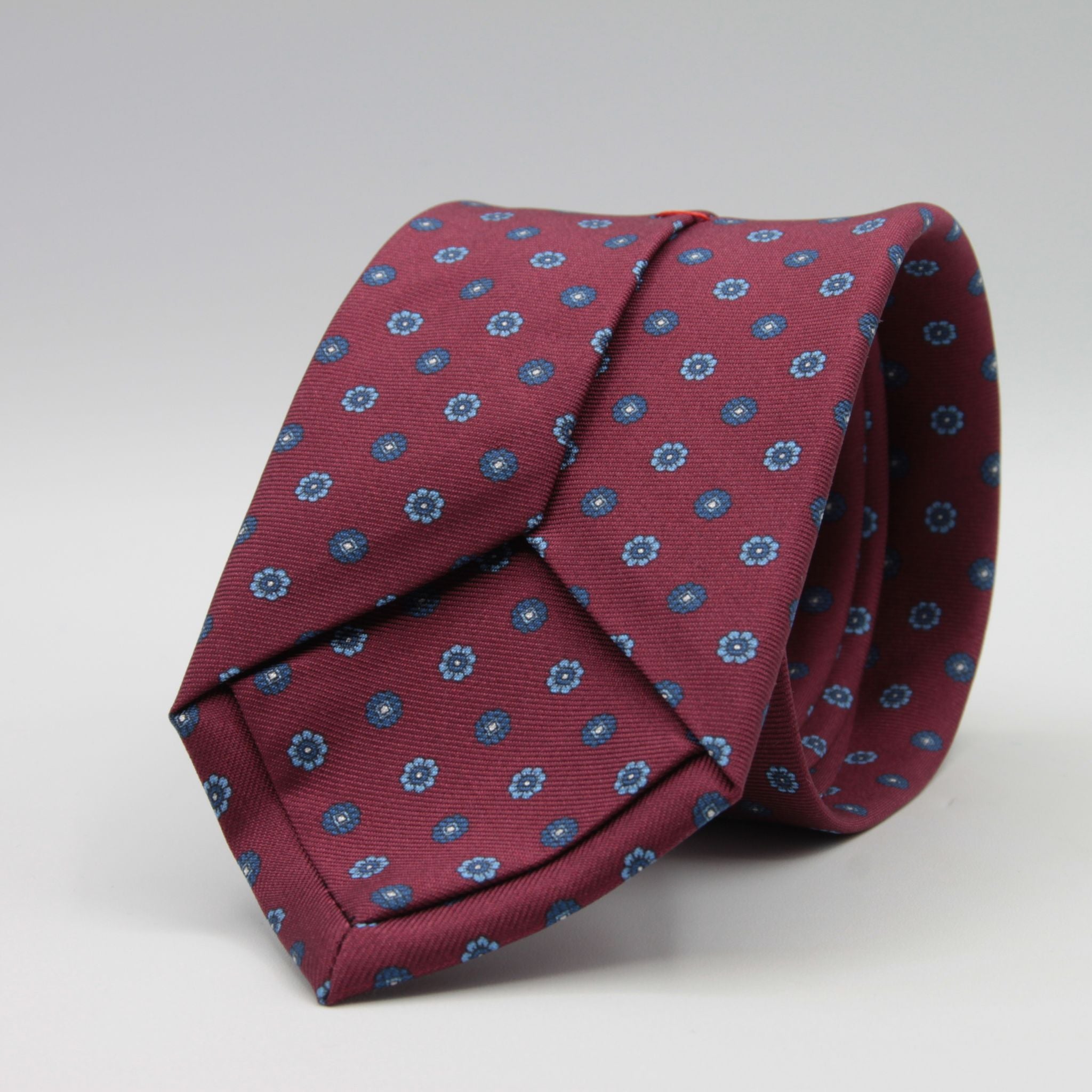Cruciani &amp; Bella
100% Printed Silk

Self-Tipped
Red Wine, Blue, Light Blue and White Motif Tie&nbsp;
Handmade in Rome, Italy.

8 cm x 150 cm
#9300