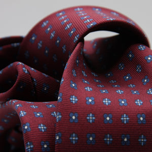 Cruciani &amp; Bella
100% Printed Silk

Self-Tipped
Red Wine, Blue, Light Blue and White Motif Tie&nbsp;
Handmade in Rome, Italy.

8 cm x 150 cm
#9304