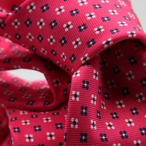 Cruciani &amp; Bella
100% Printed Silk

Self-Tipped
Fucsia, White and Blue Motif Tie
Handmade in Rome, Italy.
8 cm x 150 cm
#9427