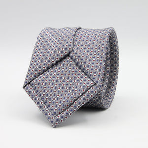 Cruciani &amp; Bella
100% Printed Silk

Self-Tipped
Grey, White, Red and Blue Motif Tie
Handmade in Rome, Italy.
8 cm x 150 cm
#9429
