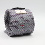 Cruciani &amp; Bella
100% Printed Silk

Self-Tipped
Grey, White, Red and Blue Motif Tie
Handmade in Rome, Italy.
8 cm x 150 cm
#9429