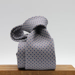 Cruciani &amp; Bella
100% Printed Silk

Self-Tipped
Grey, White, Red and Blue Motif Tie
Handmade in Rome, Italy.
8 cm x 150 cm
#9429