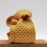 Cruciani &amp; Bella
100% Printed Silk

Self-Tipped
Light Orange, Royal Blue and Light Blue Motif Tie
Handmade in Rome, Italy.
8 cm x 150 cm
#9432