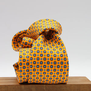 Cruciani &amp; Bella
100% Printed Silk

Self-Tipped
Light Orange, Royal Blue and Light Blue Motif Tie
Handmade in Rome, Italy.
8 cm x 150 cm
#9432