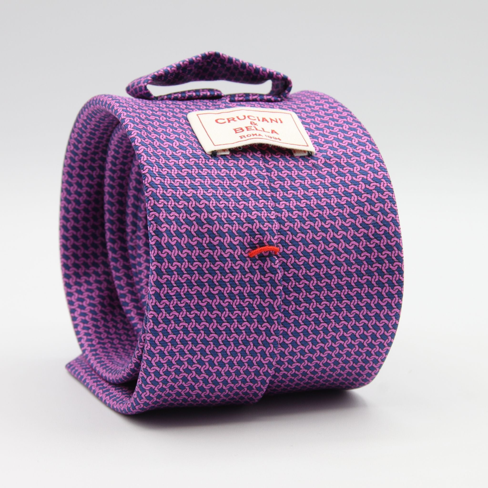 Cruciani &amp; Bella
100% Silk
Printed
Self-Tipped
Blue and Fucsia Motif Tie
Handmade in Rome, Italy.
8 cm x 150 cm
#9433