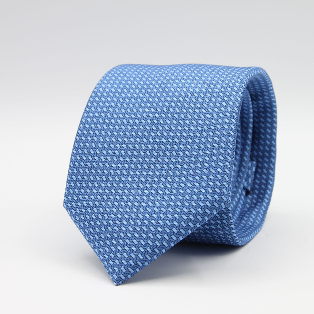 Cruciani &amp; Bella
100% Silk
Printed
Self-Tipped
Blue and Light Blue Motif Tie
Handmade in Rome, Italy.
8 cm x 150 cm
#9434