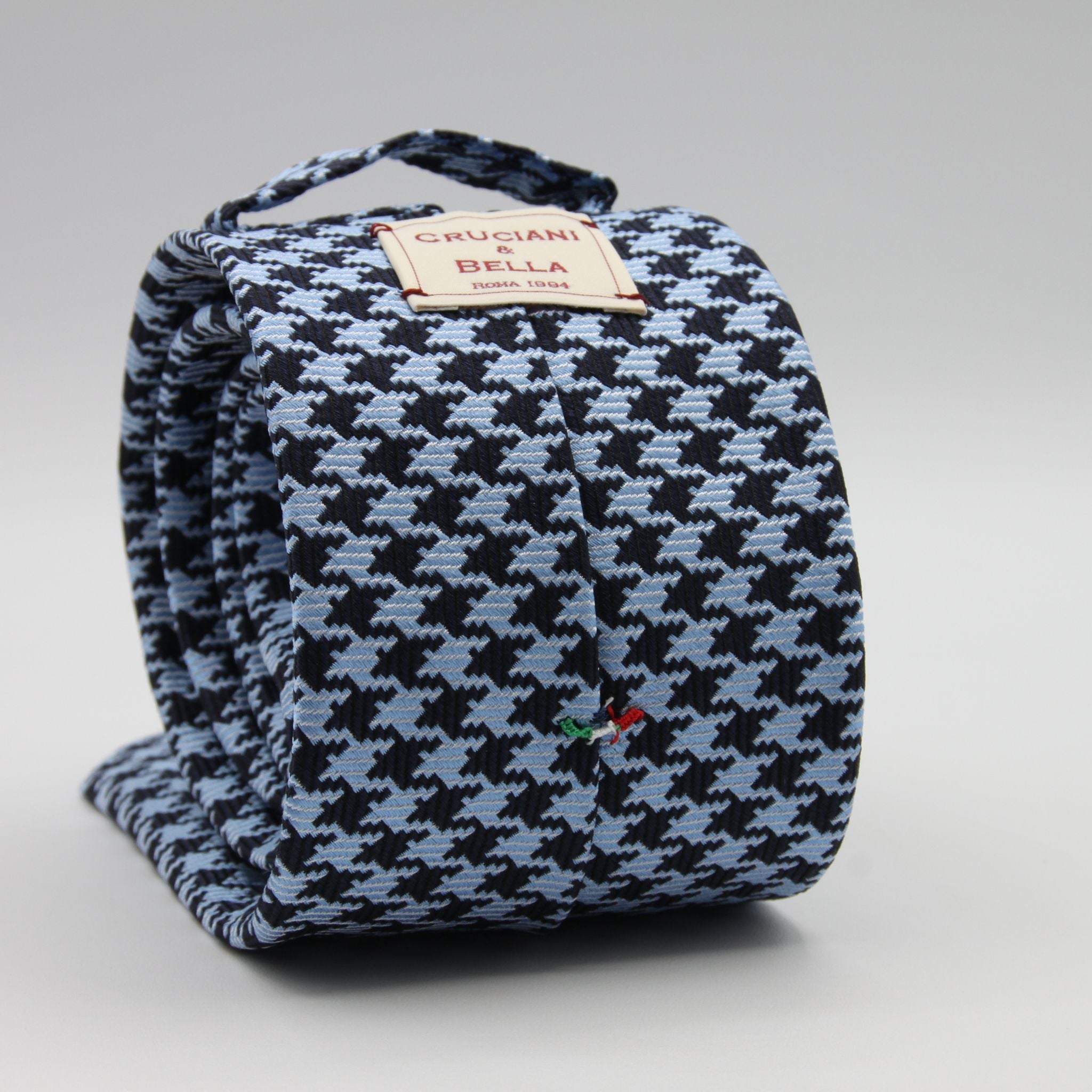 Cruciani &amp; Bella

100% Woven Jacquard silk
Tipped

Blue Navy and Baby Blue Pied de Poule &nbsp;Motif Tie
Handmade in Como, Italy
8 cm x 150 cm
#8803
