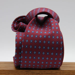 Cruciani &amp; Bella
100% Printed Silk

Self-Tipped
Red Wine, Blue, Light Blue and White Motif Tie&nbsp;
Handmade in Rome, Italy.

8 cm x 150 cm
#9304