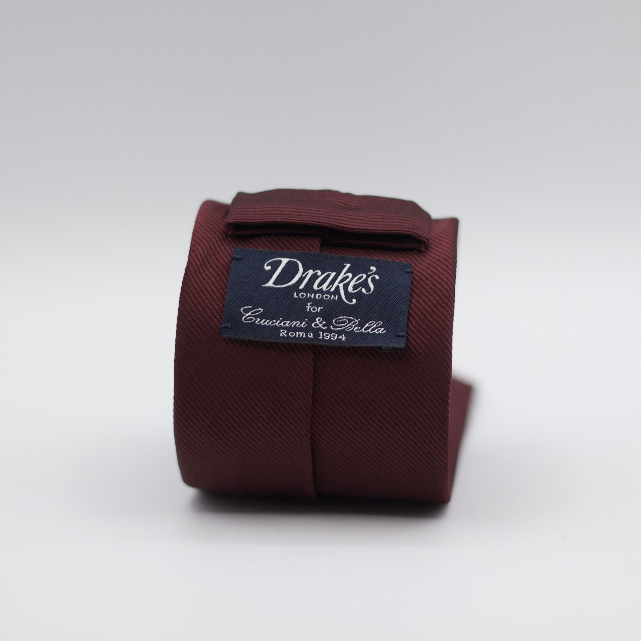 Drake's for Cruciani e Bella 100%&nbsp; Woven Satin Silk Tipped Red Wine Twill Tie Handmade in London, England 7 cm x 148 cm
