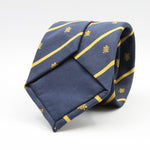 Cruciani &amp; Bella per Gentlemen Drivers
100% Woven Jacquard Silk
Tipped
Blue, Gold Stripes Crest Tie
Handmade in Italy
8 cm x 150 cm
#9204