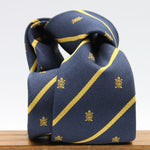 Cruciani &amp; Bella per Gentlemen Drivers
100% Woven Jacquard Silk
Tipped
Blue, Gold Stripes Crest Tie
Handmade in Italy
8 cm x 150 cm
#9204