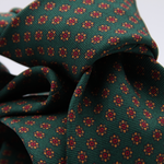 Holliday &amp; Brown for Cruciani &amp; Bella
100% printed Silk
Self Tipped
Green, Orange, Brown and Red motif tie
Exclusive tie lining
Handmade in Italy
8,5 cm x 150 cm
#10402