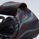 Holliday &amp; Brown for Cruciani &amp; Bella
100%&nbsp;Woven Jacquard Silk
Tipped

Brown, Royal Blue and Denim Blue Color motif tie
Handmade in Italy

8 cm x 150 cm
#8979
