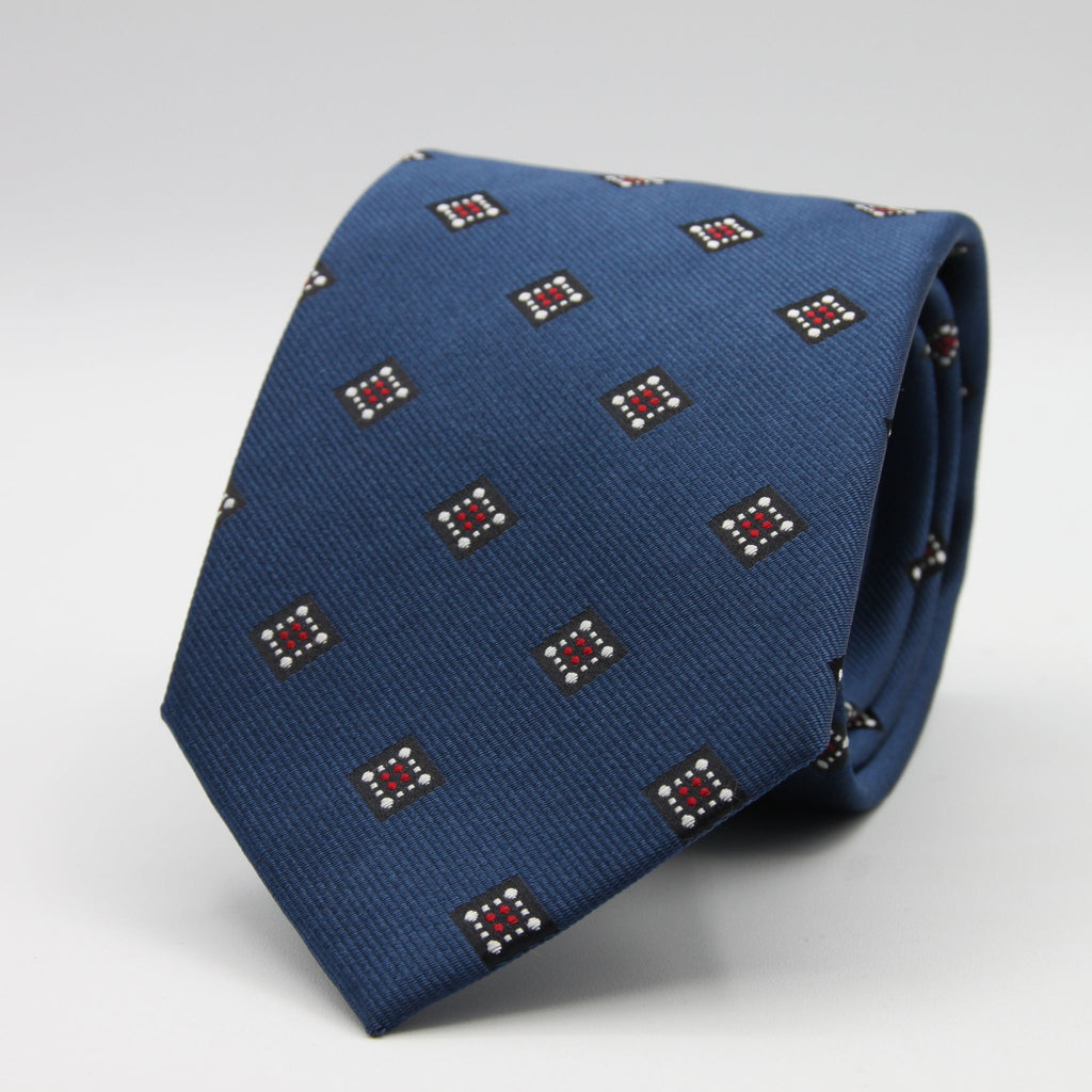 Holliday &amp; Brown for Cruciani &amp; Bella
100%&nbsp;Woven Jacquard Silk
Tipped

Blue, White and Red color motif tie
Handmade in Italy

8 cm x 150 cm
#9339