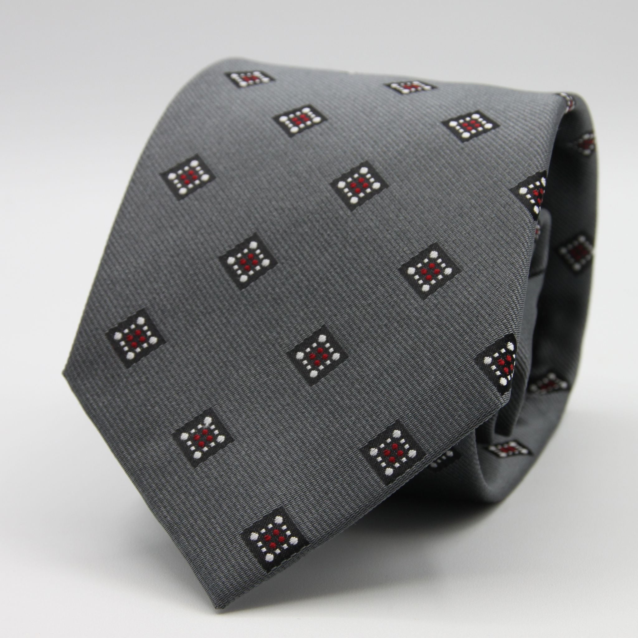 Holliday &amp; Brown for Cruciani &amp; Bella
100%&nbsp;Woven Jacquard Silk
Tipped

Grey, White and Red color motif tie
Handmade in Italy

8 cm x 150 cm
#9342