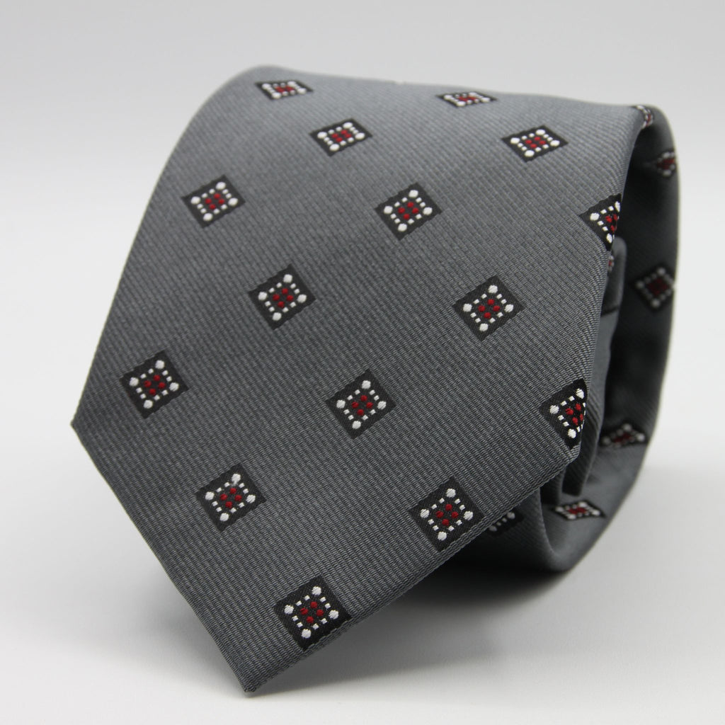 Holliday &amp; Brown for Cruciani &amp; Bella
100%&nbsp;Woven Jacquard Silk
Tipped

Grey, White and Red color motif tie
Handmade in Italy

8 cm x 150 cm
#9342