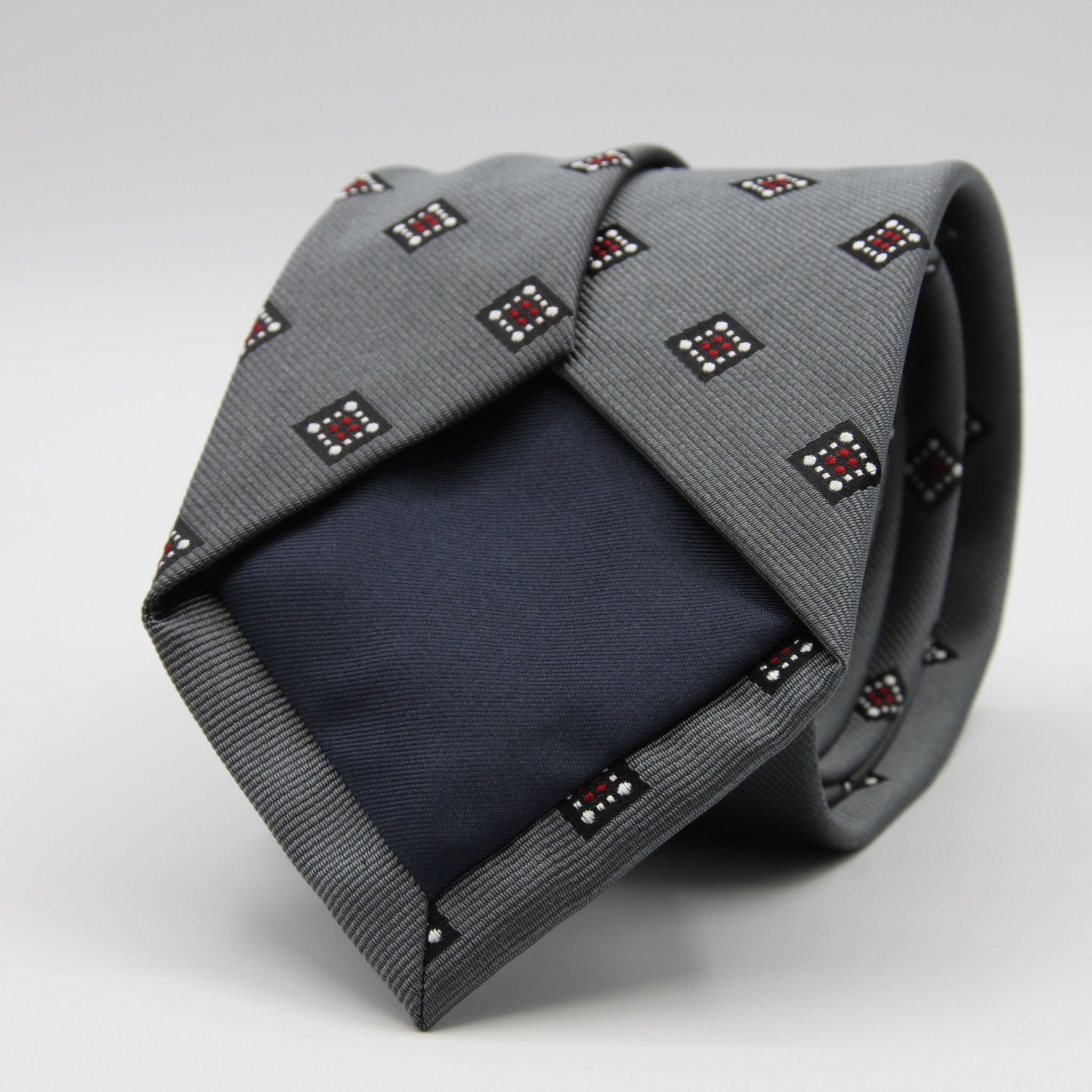 Holliday &amp; Brown for Cruciani &amp; Bella
100%&nbsp;Woven Jacquard Silk
Tipped

Grey, White and Red color motif tie
Handmade in Italy

8 cm x 150 cm
#9342