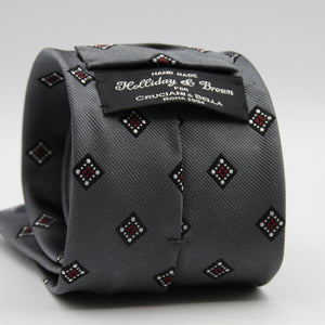 Holliday &amp; Brown for Cruciani &amp; Bella
100%&nbsp;Woven Jacquard Silk
Tipped

Grey, White and Red color motif tie
Handmade in Italy

8 cm x 150 cm
#9342