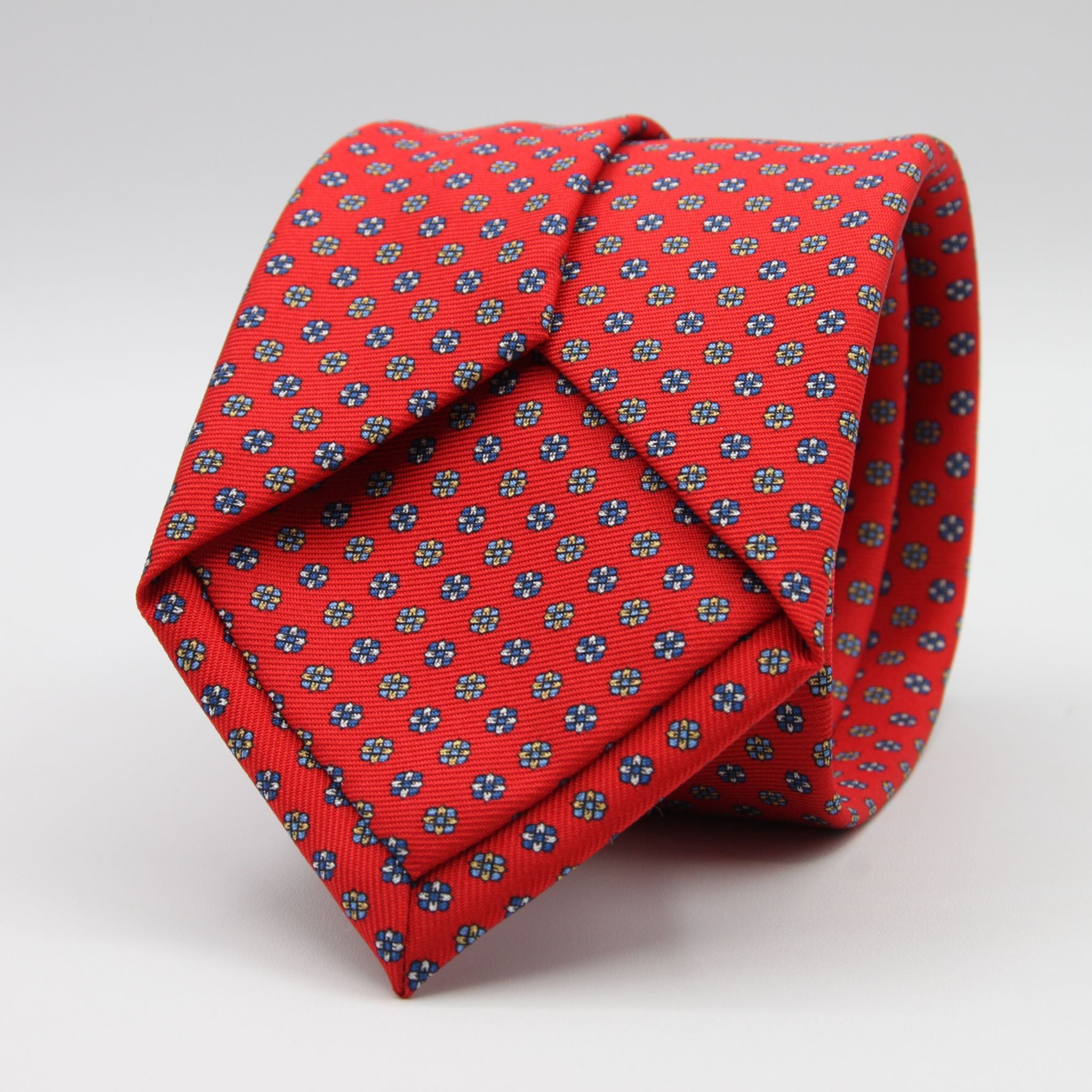 Holliday &amp; Brown for Cruciani &amp; Bella
100% Printed Silk
Self Tipped
Red, Royal Blue, Light Blue and Yellow motif Tie
Handmade in Italy
8 cm x 150 cm
#9353