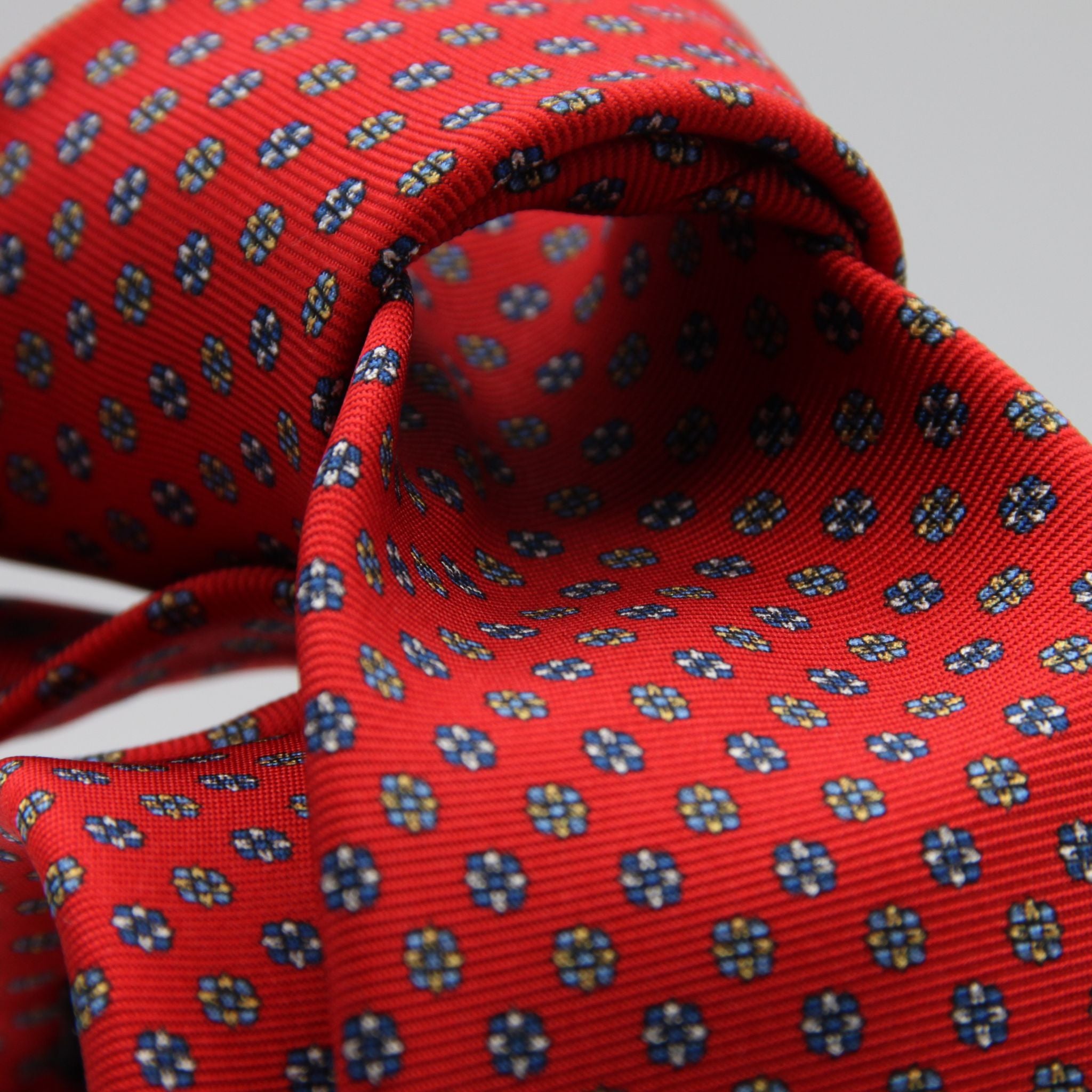 Holliday &amp; Brown for Cruciani &amp; Bella
100% Printed Silk
Self Tipped
Red, Royal Blue, Light Blue and Yellow motif Tie
Handmade in Italy
8 cm x 150 cm
#9353