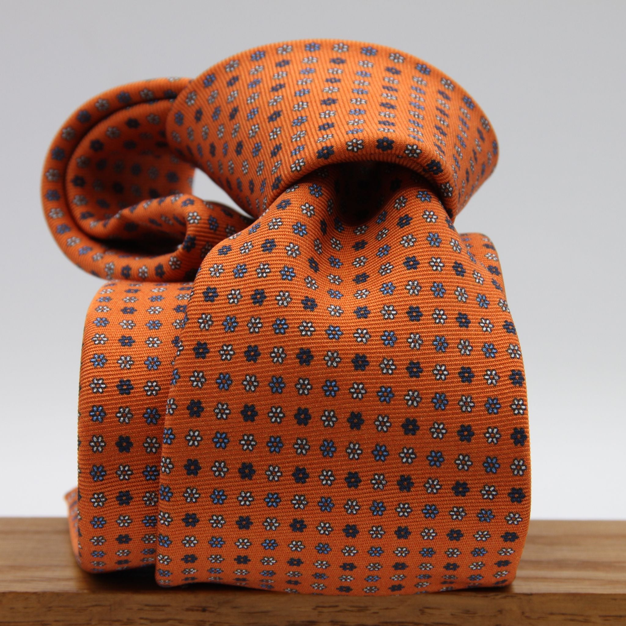 Holliday &amp; Brown for Cruciani &amp; Bella
100% Printed Silk
Self Tipped
Light Orange, Navy Blue, Light Blue and White motif Tie
Handmade in Italy
8 cm x 150 cm
#9354