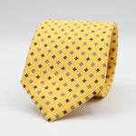 Holliday &amp; Brown for Cruciani &amp; Bella
100% Printed Silk
Self Tipped
Yellow, Navy Blue, Light Blue and White motif Tie
Handmade in Italy
8 cm x 150 cm
#9356