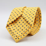 Holliday &amp; Brown for Cruciani &amp; Bella
100% Printed Silk
Self Tipped
Yellow, Navy Blue, Light Blue and White motif Tie
Handmade in Italy
8 cm x 150 cm
#9356