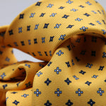Holliday &amp; Brown for Cruciani &amp; Bella
100% Printed Silk
Self Tipped
Yellow, Navy Blue, Light Blue and White motif Tie
Handmade in Italy
8 cm x 150 cm
#9356