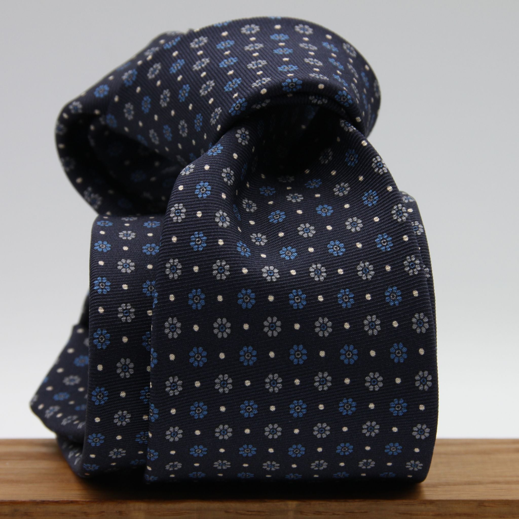 Holliday &amp; Brown for Cruciani &amp; Bella
100% Printed Silk
Self Tipped
Dark Blue, Light Blue, Grey and Fuchsia motif Tie
Handmade in Italy
8 cm x 150 cm
#9360