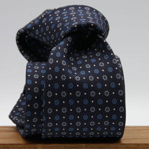 Holliday &amp; Brown for Cruciani &amp; Bella
100% Printed Silk
Self Tipped
Dark Blue, Light Blue, Grey and Fuchsia motif Tie
Handmade in Italy
8 cm x 150 cm
#9360