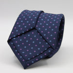 Holliday &amp; Brown for Cruciani &amp; Bella
100% Printed Silk
Self Tipped
Navy Blue, Purple and Light Blue motif Tie
Handmade in Italy
8 cm x 150 cm
#9361