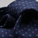Holliday &amp; Brown for Cruciani &amp; Bella
100% Printed Silk
Self Tipped
Navy Blue, Purple and Light Blue motif Tie
Handmade in Italy
8 cm x 150 cm
#9361