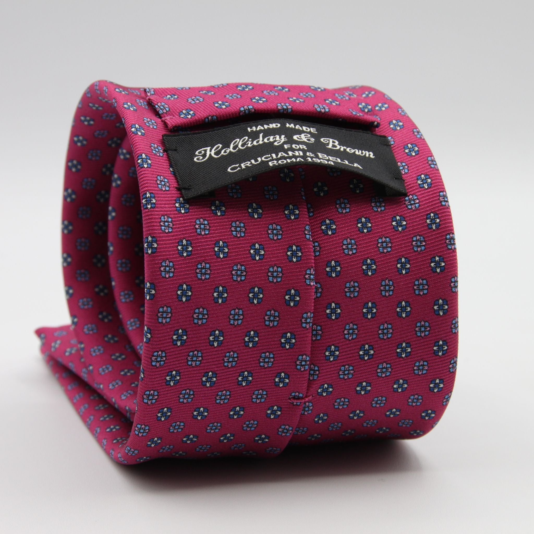 Holliday &amp; Brown for Cruciani &amp; Bella
100% Printed Silk
Self Tipped
Magenta, Blue, Pink, Light Blue and White motif Tie
Handmade in Italy
8 cm x 150 cm
#9364