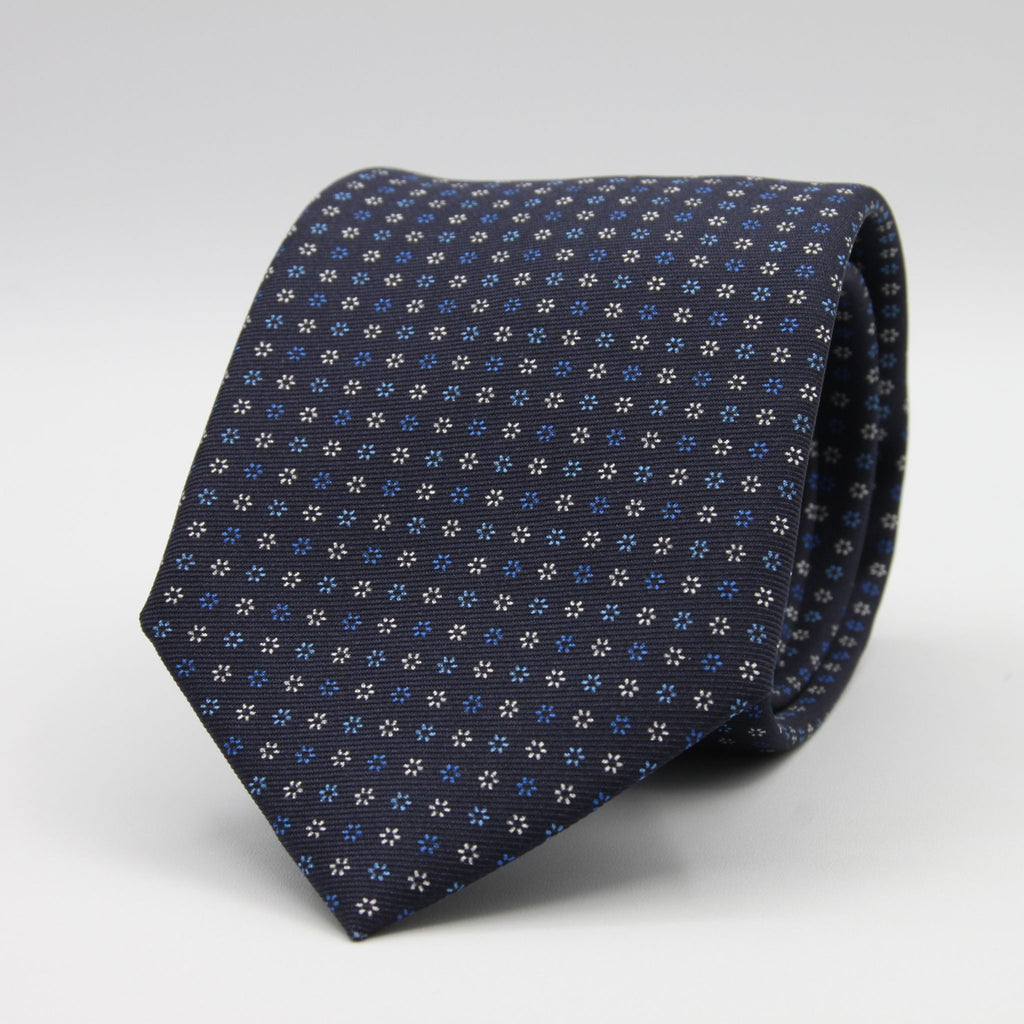 Holliday &amp; Brown for Cruciani &amp; Bella
100% Printed Silk
Self Tipped
Navy Blue, Light Blue and White motif Tie
Handmade in Italy
8 cm x 150 cm
#9365