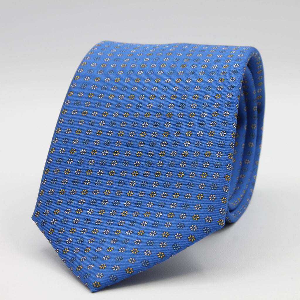 Holliday &amp; Brown for Cruciani &amp; Bella
100% Printed Silk
Self Tipped
Light Blue, Yellow and White motif Tie
Handmade in Italy
8 cm x 150 cm
#9366