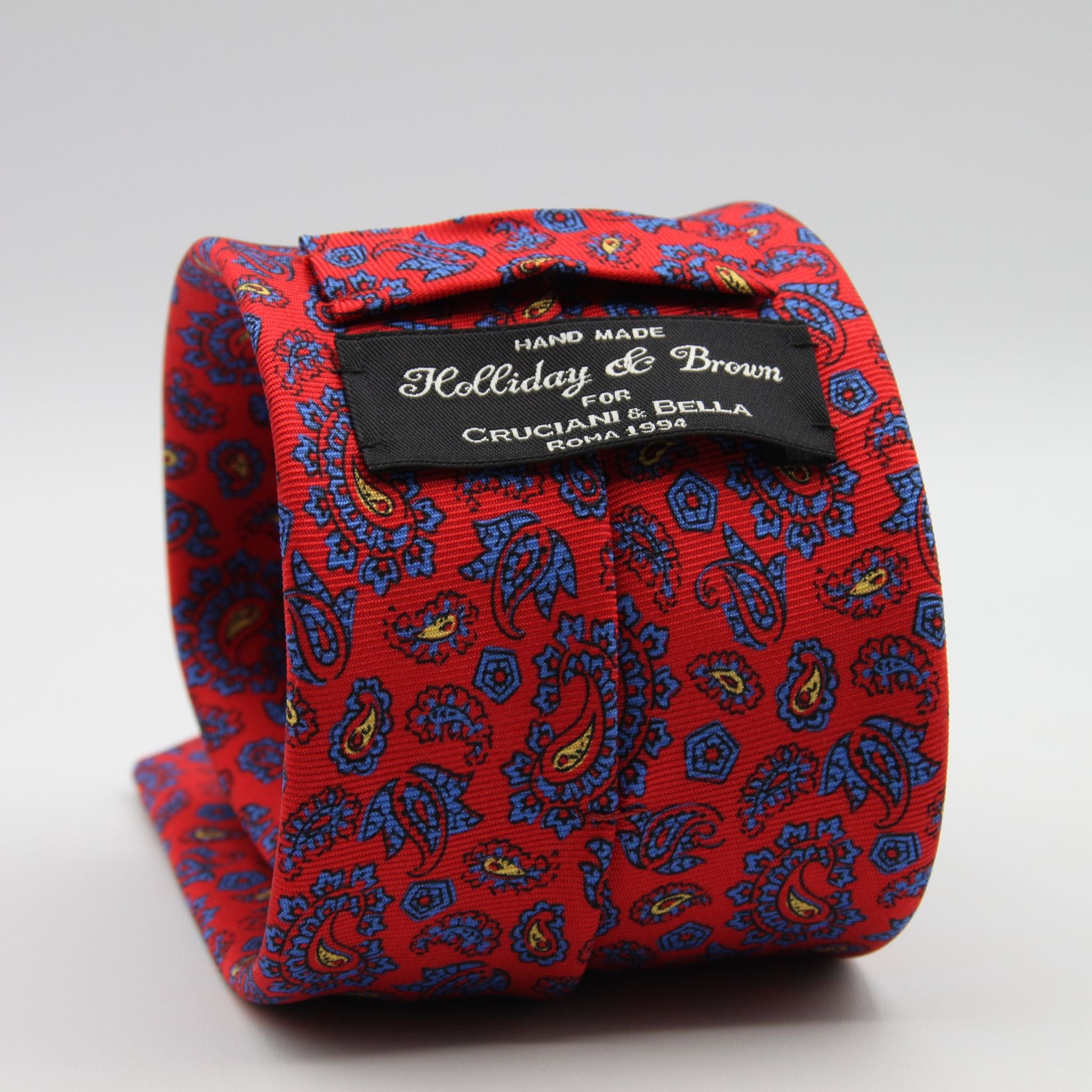 Holliday &amp; Brown for Cruciani &amp; Bella
100% Printed Silk
Self Tipped
Red, Light Blue and Yellow motif Tie
Handmade in Italy
8 cm x 150 cm
#9369