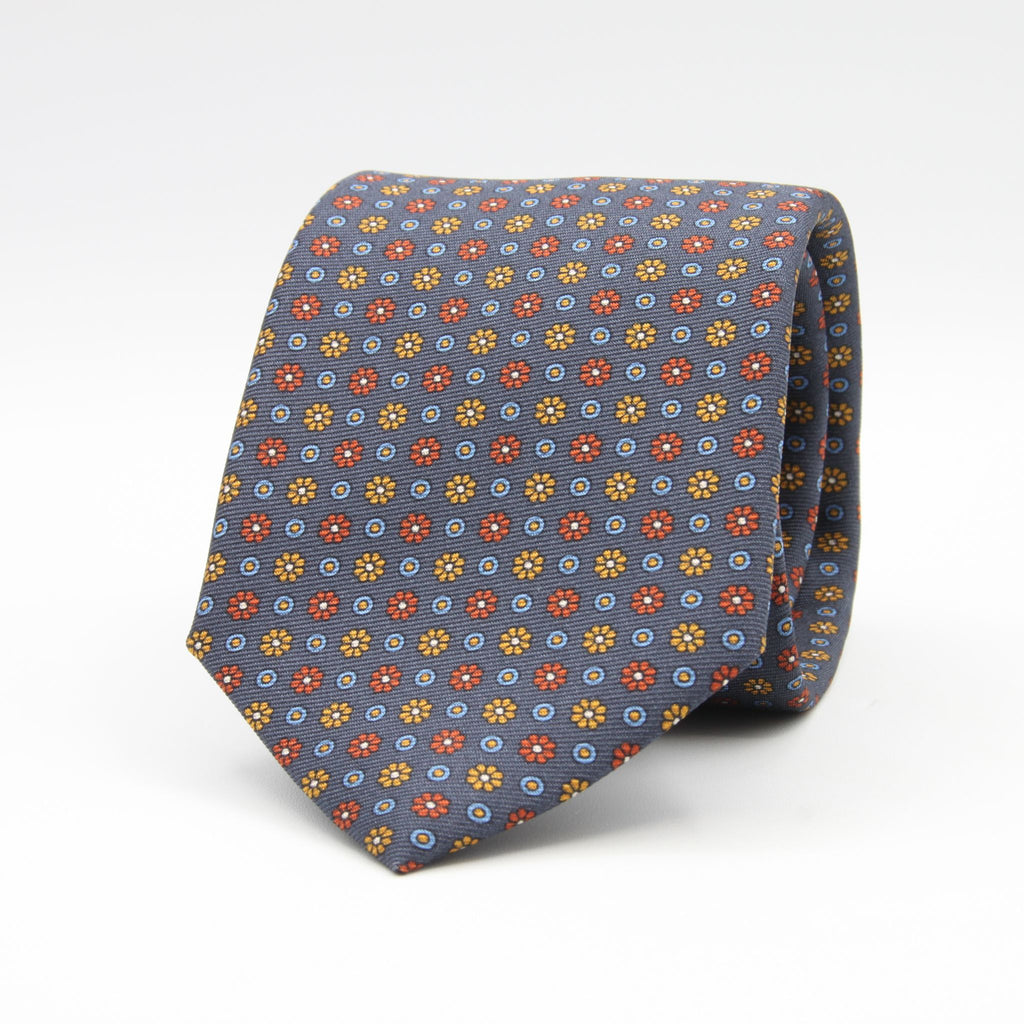 Holliday &amp; Brown for Cruciani &amp; Bella
100% Printed Silk
Self Tipped
Dark Grey Metallic, Rust, Brown and Light Blue motif Tie
Handmade in Italy
8 cm x 150 cm
#9447