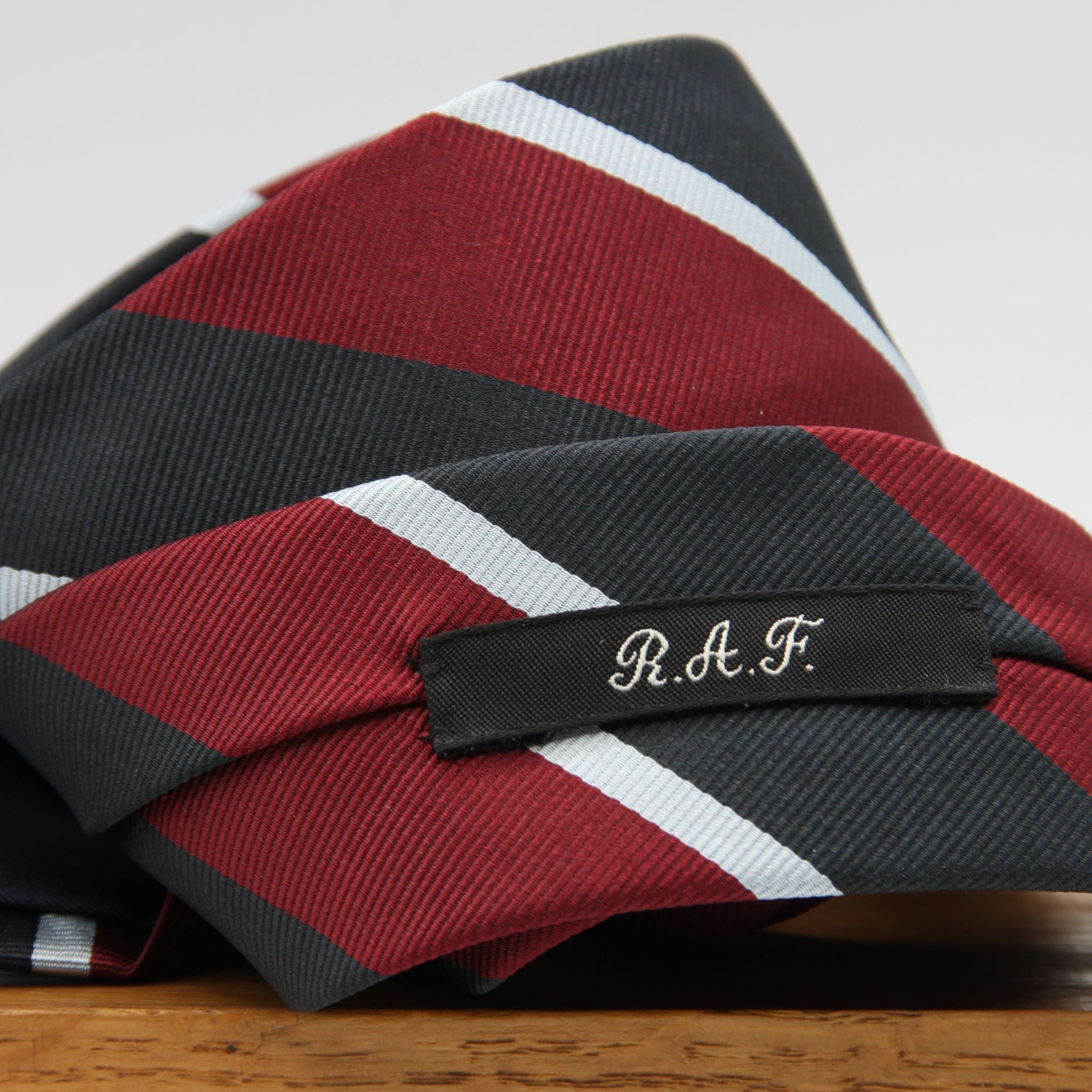 Holliday &amp; Brown
100% Jacquard Silk
Tipped
"R.A.F." Regimental Tie

Handmade in Italy
8 cm x 148 cm
#8813