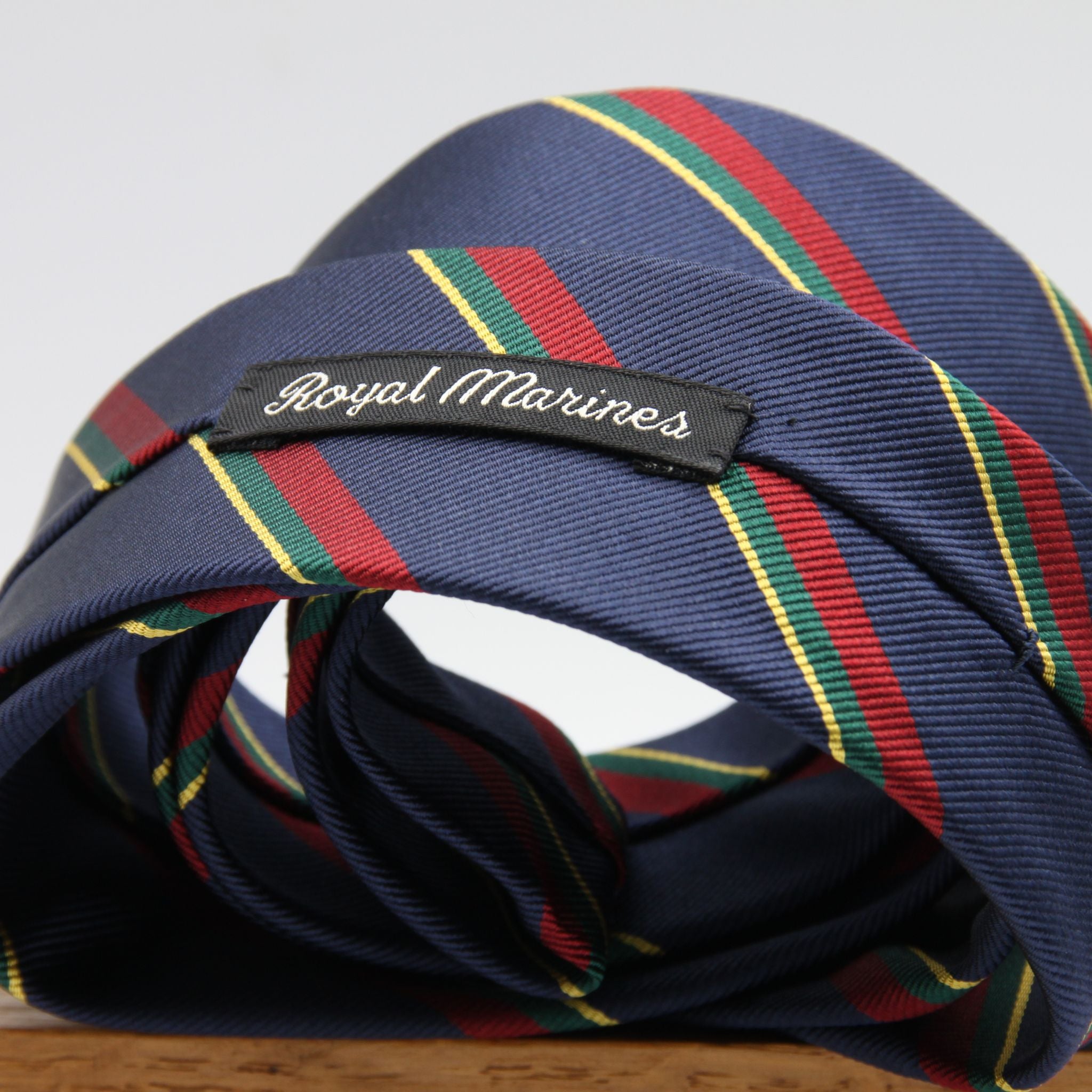 Holliday &amp; Brown
100% Jacquard Silk
Tipped
"Royal Marines" Regimental Tie
Blue, Red, Green and Yellow Stripes
Handmade in Italy
8 cm x 148 cm
#8810