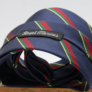 Holliday &amp; Brown
100% Jacquard Silk
Tipped
"Royal Marines" Regimental Tie
Blue, Red, Green and Yellow Stripes
Handmade in Italy
8 cm x 148 cm
#8810