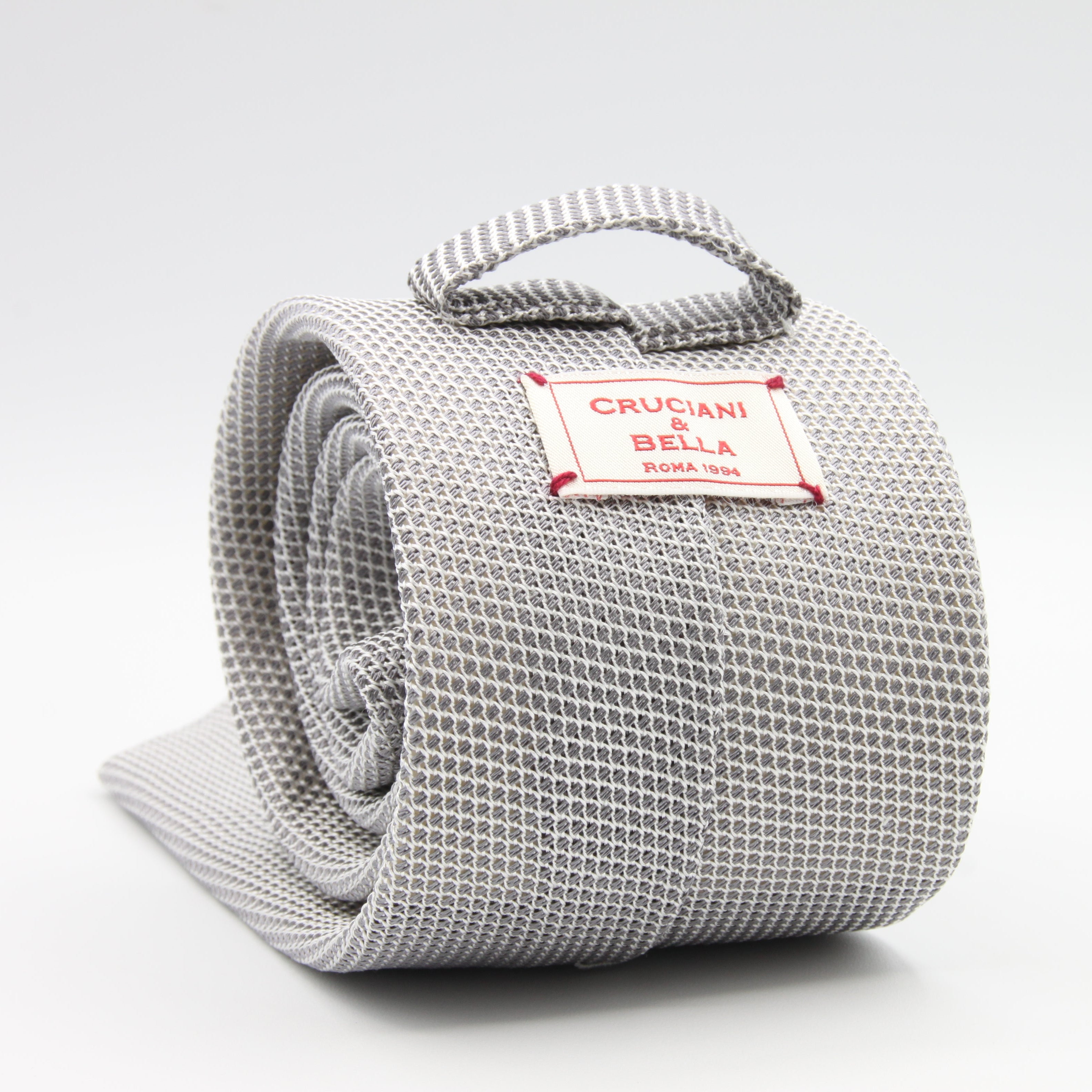 Cruciani &amp; Bella Tie
100% Silk Grenadine garza fina&nbsp;
Tipped

Plain Grey and white tie
Handmade in Italy

8 cm x 150 cm
#9506
