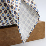 Cruciani &amp; Bella Tie
Handmade and Printed in Italy
Unlined
Hand Rolled
Off-White, Blue and Orange Tie
100% Printed Madder Silk
8 X 150 Cm
#9539