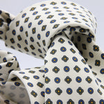 Cruciani &amp; Bella Tie
Handmade and Printed in Italy
Unlined
Hand Rolled
Off-White, Green, Blue and Orange Tie
100% Printed Madder Silk
8 X 150 Cm
#9536