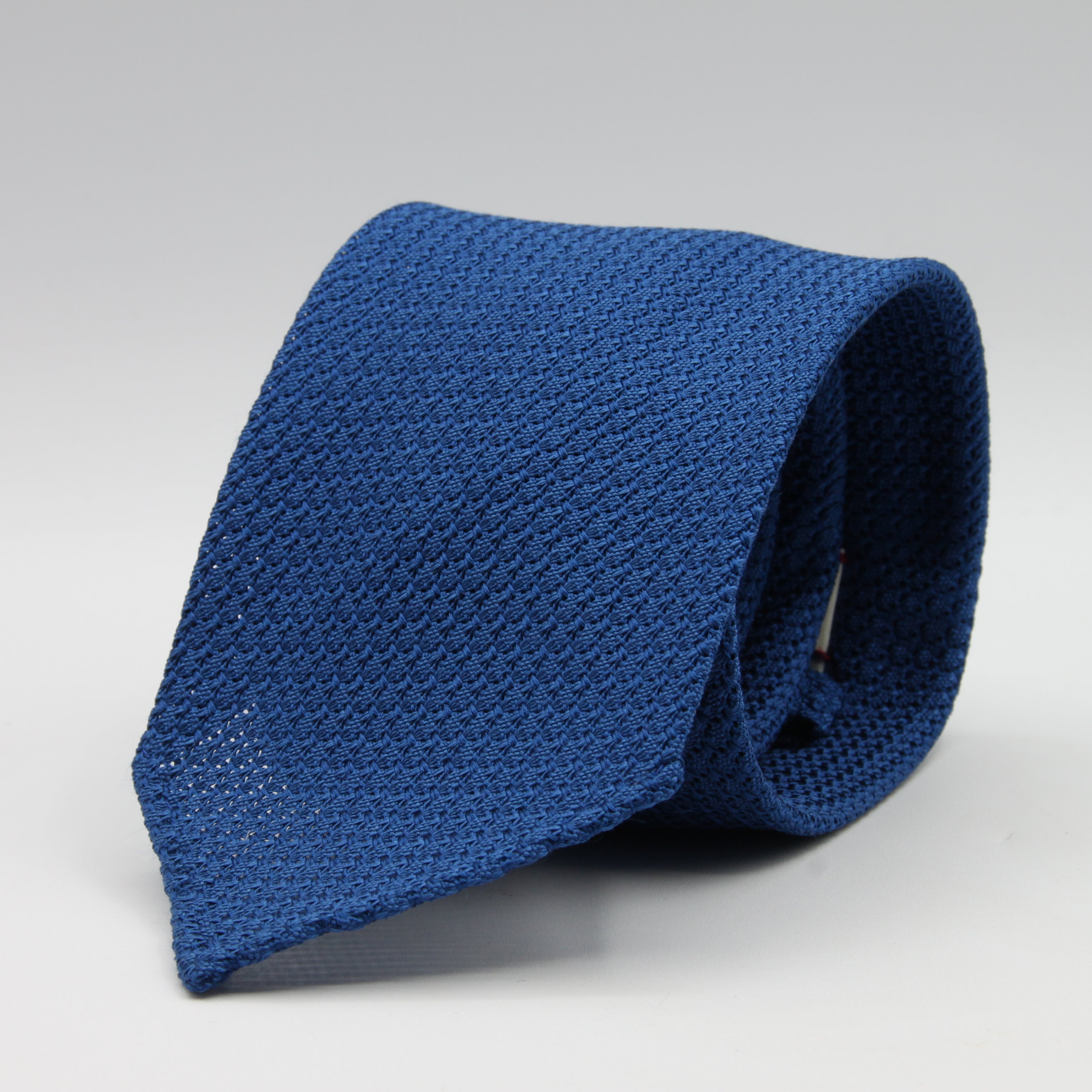 Cruciani &amp; Bella Tie
100% Silk Grenadine Garza Grossa

Unlined
Plain Olympic Blue Tie
Handmade in Italy
8 cm x 150 cm

#8602