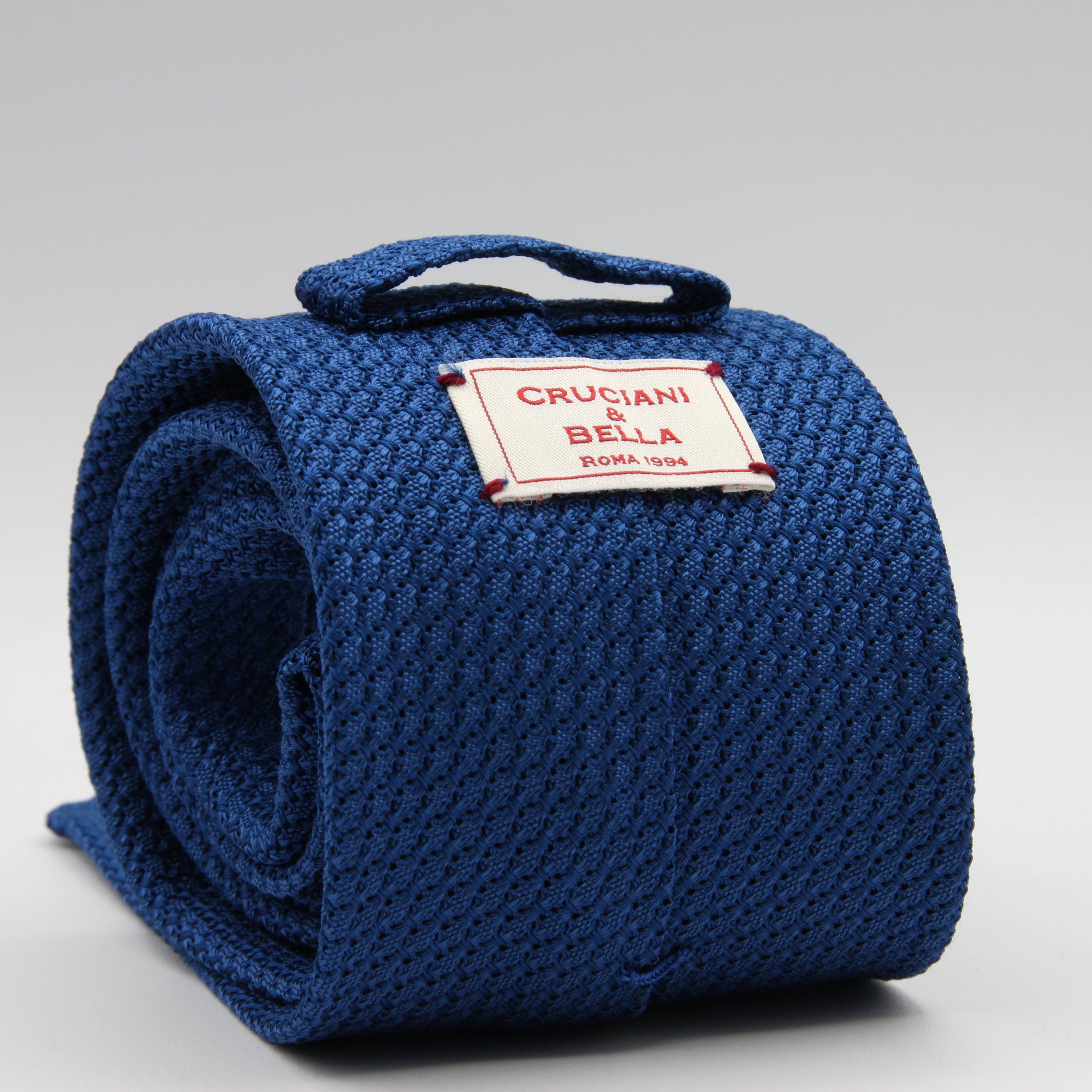 Cruciani &amp; Bella Tie
100% Silk Grenadine Garza Grossa

Unlined
Plain Olympic Blue Tie
Handmade in Italy
8 cm x 150 cm

#8602