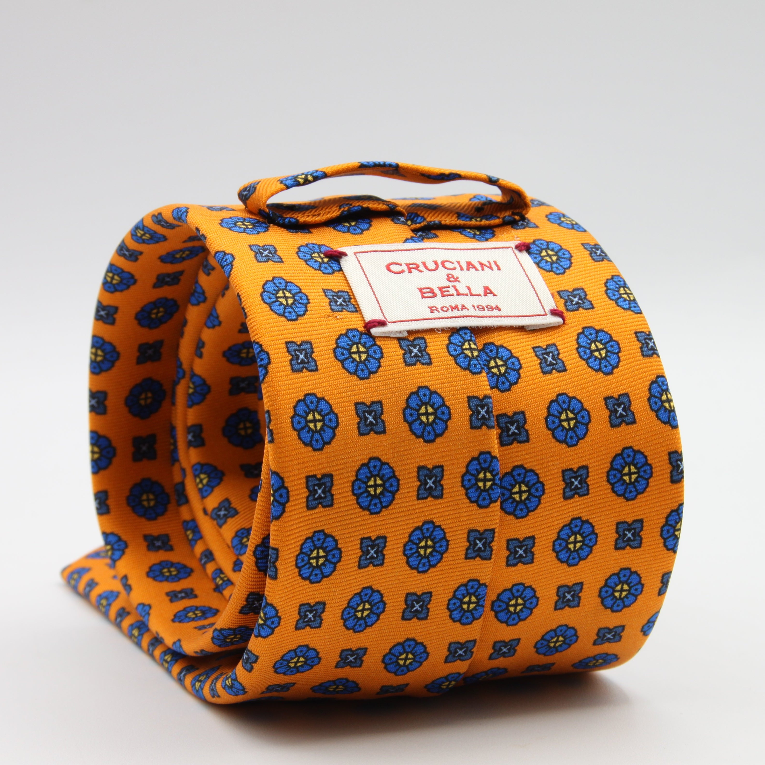 Cruciani &amp; Bella Tie
100%&nbsp; Silk
Printed and Handmade in Italy
Self-Tipped
Orange and Blue Tie

8 cm x 150 cm
#9611