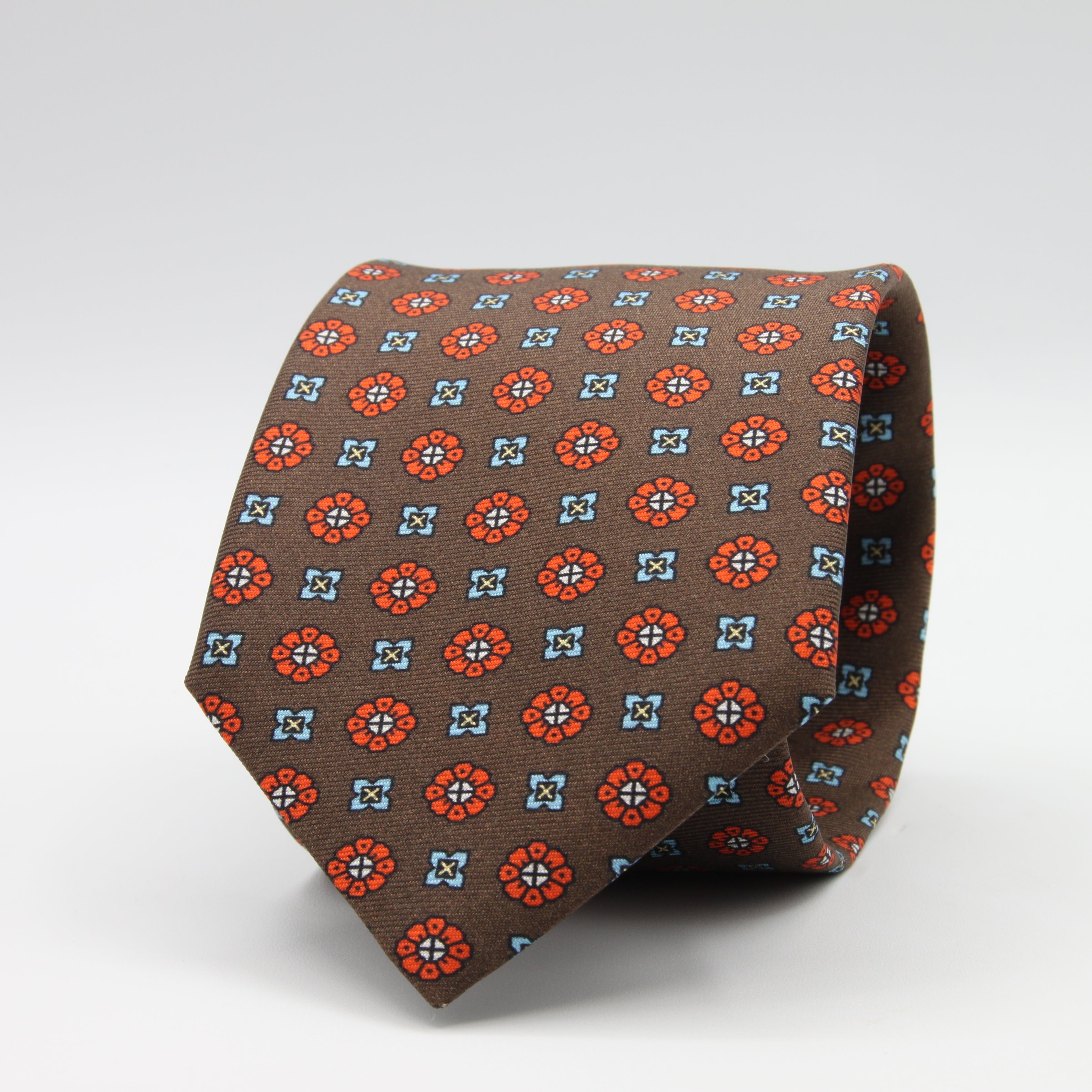 Cruciani &amp; Bella Tie
100%&nbsp; Silk
Printed and Handmade in Italy
Self-Tipped
Brown, Orange and Sky Blue Tie

8 cm x 150 cm
#9610