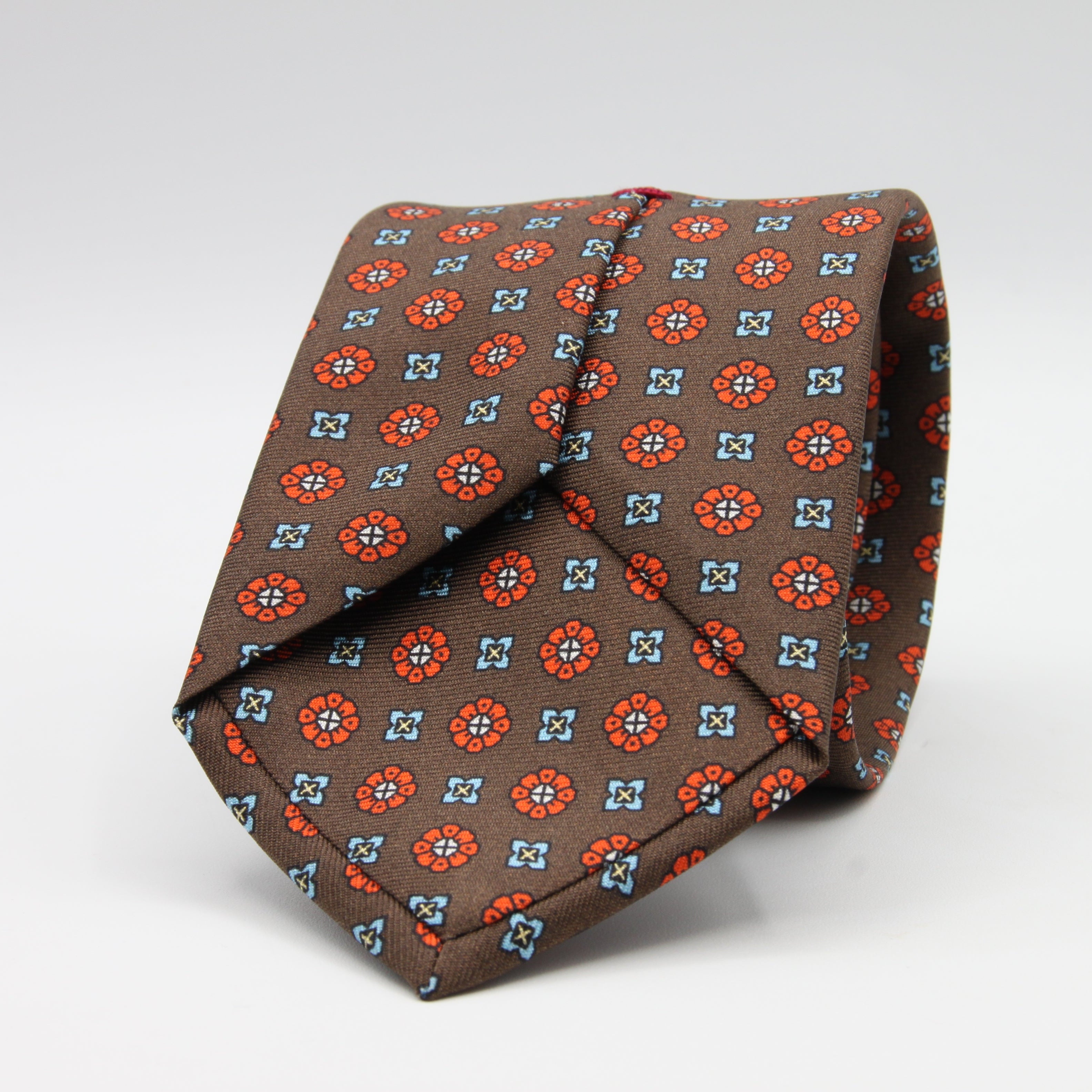 Cruciani &amp; Bella Tie
100%&nbsp; Silk
Printed and Handmade in Italy
Self-Tipped
Brown, Orange and Sky Blue Tie

8 cm x 150 cm
#9610