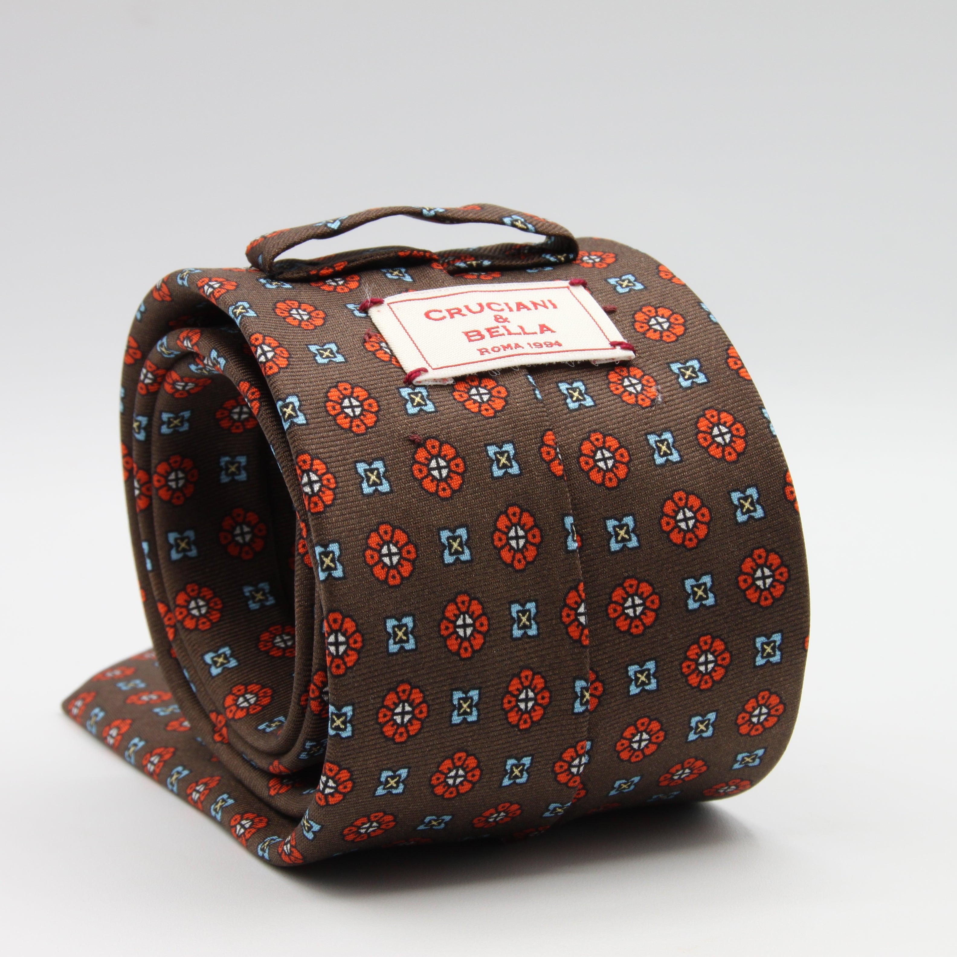Cruciani &amp; Bella Tie
100%&nbsp; Silk
Printed and Handmade in Italy
Self-Tipped
Brown, Orange and Sky Blue Tie

8 cm x 150 cm
#9610
